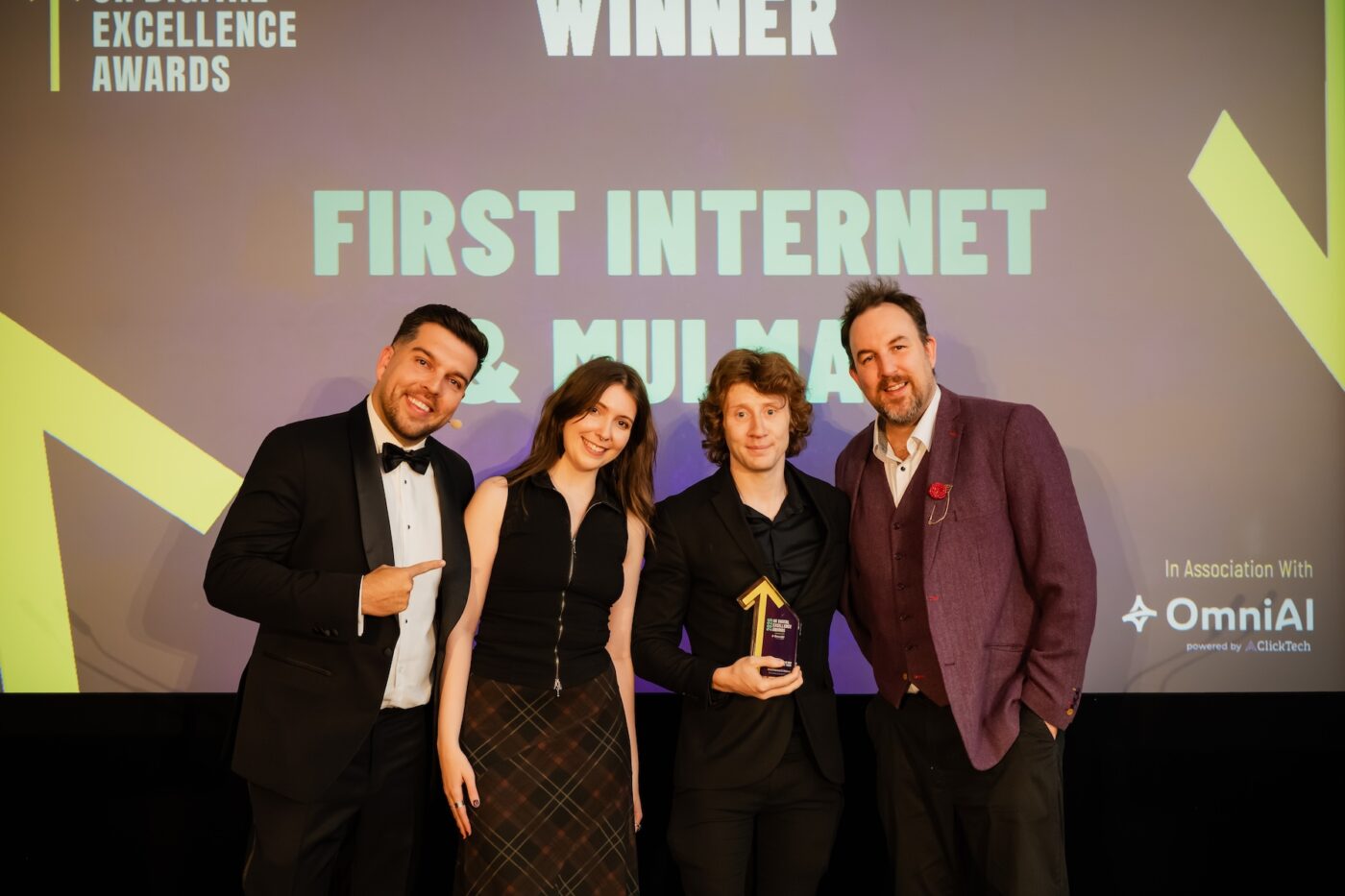 seo team receiving award on stage at Uk digital excellence awards 2026